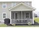 The screened porch features a comfortable seating area and a grill at 683 Yellow Leaf Ln, Summerville, SC 29486