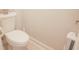 Clean and simple water closet featuring a white toilet, white wall, and neutral flooring at 683 Yellow Leaf Ln, Summerville, SC 29486