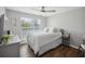 Bright bedroom with hardwood floors and white linens at 700 Daniel Ellis Dr # 10305, Charleston, SC 29412