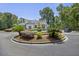 Elegant community entrance with a beautiful water fountain and lush landscaping at 700 Daniel Ellis Dr # 10305, Charleston, SC 29412