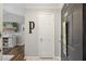 Foyer with hardwood floors, white walls, and decorated black door at 700 Daniel Ellis Dr # 10305, Charleston, SC 29412