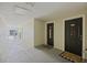 Hallway of condo building with two doors and welcome mats on the floor at 700 Daniel Ellis Dr # 10305, Charleston, SC 29412