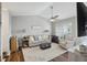 Comfortable living room with a high ceiling, ceiling fan and a cozy seating arrangement at 700 Daniel Ellis Dr # 10305, Charleston, SC 29412