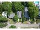 Aerial view of houses on a leafy street shows nice yards and neighborhood features at 708 Pitt St, Mount Pleasant, SC 29464