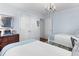 Bedroom with two twin beds and ample closet space, illuminated by a chandelier at 708 Pitt St, Mount Pleasant, SC 29464