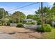 Quaint home boasts a charming white picket fence, lush landscaping, and inviting curb appeal at 708 Pitt St, Mount Pleasant, SC 29464