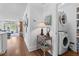 Hallway with hardwood floors, laundry closet and access to living area at 708 Pitt St, Mount Pleasant, SC 29464