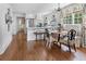 Elegant kitchen with white cabinetry, hardwood floors, and a breakfast nook, perfect for Gathering gatherings at 708 Pitt St, Mount Pleasant, SC 29464
