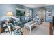 Bright living room with stylish decor, comfortable seating, and ample natural light at 708 Pitt St, Mount Pleasant, SC 29464