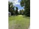 View of the lot, with trees and a shed at 7413 N Highway 17, Awendaw, SC 29429