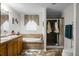 Well-appointed bathroom featuring double sinks, soaking tub, and separate shower, offering a luxurious experience at 785 Coral Acres Dr, Moncks Corner, SC 29461