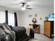Comfortable bedroom featuring a plush bed, ceiling fan, and neutral tones, creating a relaxing retreat at 785 Coral Acres Dr, Moncks Corner, SC 29461