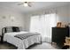 Bright bedroom showcasing a queen-sized bed, white walls, and natural light streaming through sheer curtains at 785 Coral Acres Dr, Moncks Corner, SC 29461