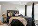 Relaxing bedroom with a king-size bed, dark accents, and plenty of pillows for a comfortable, serene space at 785 Coral Acres Dr, Moncks Corner, SC 29461