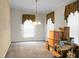 Empty dining room with traditional chandelier and neutral wall tones ready to be customized at 785 Coral Acres Dr, Moncks Corner, SC 29461
