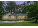 Charming single-story home featuring a cozy porch and landscaped front yard at 785 Coral Acres Dr, Moncks Corner, SC 29461