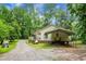 Exterior view of the home featuring an attached car port and fire pit at 785 Coral Acres Dr, Moncks Corner, SC 29461