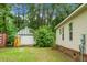 The home's exterior featuring a garage-style shed and some greenery at 785 Coral Acres Dr, Moncks Corner, SC 29461
