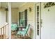 Cozy front porch with seating and welcoming entrance at 785 Coral Acres Dr, Moncks Corner, SC 29461