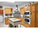 Traditional eat-in kitchen with stainless steel appliances, gray countertops, and butcher block island at 785 Coral Acres Dr, Moncks Corner, SC 29461