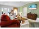 Spacious living room featuring a large entertainment center, and stylish furniture at 785 Coral Acres Dr, Moncks Corner, SC 29461