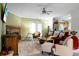 Comfortable living room with fireplace, neutral tones, and access to the kitchen at 785 Coral Acres Dr, Moncks Corner, SC 29461