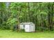Small shed with a window sitting in the backyard at 785 Coral Acres Dr, Moncks Corner, SC 29461