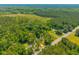 Expansive aerial view highlighting the home's location amid lush greenery, emphasizing its peaceful setting at 8453 Charleston Hwy, Walterboro, SC 29488