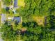 An aerial view showing a home with a private lot surrounded by dense trees, offering a serene setting at 8453 Charleston Hwy, Walterboro, SC 29488