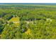 Overhead view capturing the residence nestled amongst mature trees, showcasing its private and tranquil environment at 8453 Charleston Hwy, Walterboro, SC 29488