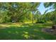 Expansive backyard featuring a well-manicured lawn and mature trees at 8453 Charleston Hwy, Walterboro, SC 29488