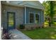 Detailed view of the home's brick and siding exterior, complemented by manicured landscaping and a welcoming entrance at 8453 Charleston Hwy, Walterboro, SC 29488