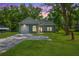 Charming single-story home with a lush green lawn and a long driveway leading to an attached garage at 8453 Charleston Hwy, Walterboro, SC 29488