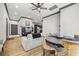 Open-concept living space showcasing a sectional sofa, media center, and a seamless transition to the modern kitchen at 8453 Charleston Hwy, Walterboro, SC 29488