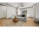 Bright living room with a sectional sofa, a ceiling fan, recessed lighting, and an ottoman on a patterned rug at 8453 Charleston Hwy, Walterboro, SC 29488