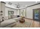 Spacious living room featuring a comfortable sectional sofa, stylish rug, and natural light from the large windows at 8453 Charleston Hwy, Walterboro, SC 29488