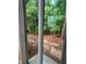 View of backyard with trees through a sliding glass door at 9410 Sweep Dr, Summerville, SC 29485