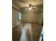 Spacious bedroom with a ceiling fan, carpeted floor, and two windows at 9410 Sweep Dr, Summerville, SC 29485