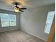 A bedroom with carpet and natural light from two windows and a ceiling fan at 9410 Sweep Dr, Summerville, SC 29485