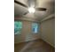 Bedroom with carpet and natural light from two windows and a ceiling fan at 9410 Sweep Dr, Summerville, SC 29485
