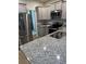 Updated kitchen featuring granite countertops and stainless steel appliances at 9410 Sweep Dr, Summerville, SC 29485