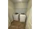 A well-lit laundry room with washer and dryer at 9410 Sweep Dr, Summerville, SC 29485