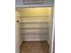 A large pantry with four rows of wire shelving and wood flooring at 9410 Sweep Dr, Summerville, SC 29485