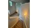 View from the stairway landing of the soaring ceilings and bright natural light at 9410 Sweep Dr, Summerville, SC 29485