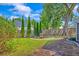 Backyard with patio featuring a circle of gravel, four chairs and a firepit at 9682 Pebble Creek Blvd, Summerville, SC 29485