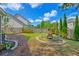 Well-maintained backyard offering a fire pit area and privacy fence with ample green space for outdoor activities at 9682 Pebble Creek Blvd, Summerville, SC 29485
