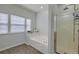 Bright bathroom showcasing a glass-enclosed shower, soaking tub, and natural light at 9682 Pebble Creek Blvd, Summerville, SC 29485