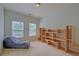 Spacious bedroom featuring neutral carpet, a large window and ample space for furniture at 9682 Pebble Creek Blvd, Summerville, SC 29485
