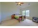 Bright bedroom with vaulted ceiling, ceiling fan, carpeted floors and ample natural light at 9682 Pebble Creek Blvd, Summerville, SC 29485