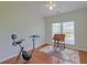 Bedroom featuring a ceiling fan, hardwood floors and a window for natural light at 9682 Pebble Creek Blvd, Summerville, SC 29485